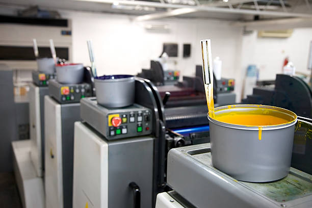 Ink tins sitting on top of a lithographic printing press...For more print industry images click on the banner below...